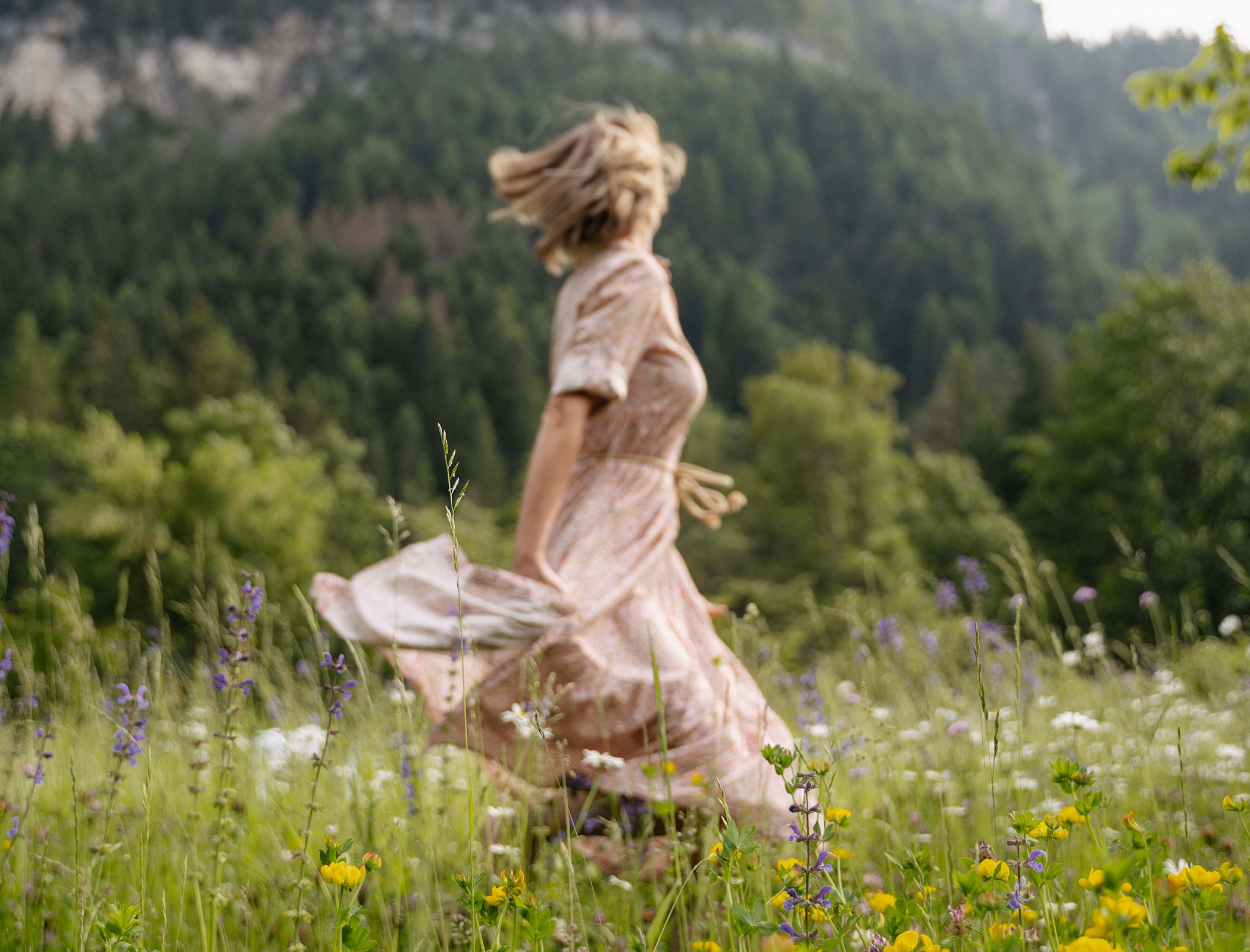 Woman dancing in the meadow